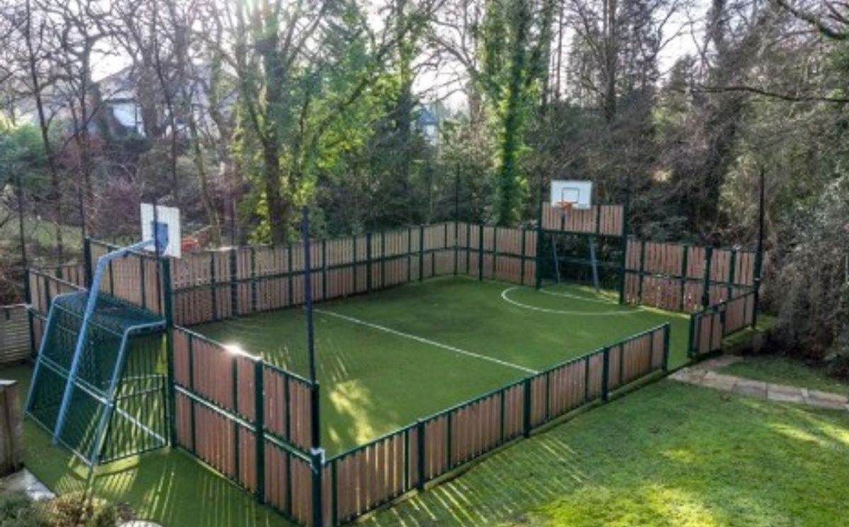 The football pitch doubles as a basketball court