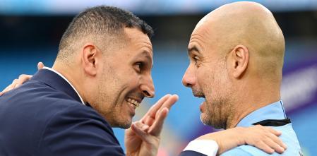 MANCHESTER, ENGLAND - MAY 22: Pep Guardiola and Khaldoon Al Mubarak, Chairperson of Manchester City celebrate after their side finished the season as Premier League champions during the Premier League match between Manchester City and Aston Villa at Etihad Stadium on May 22, 2022 in Manchester, England. (Photo by Shaun Botterill/Getty Images)
